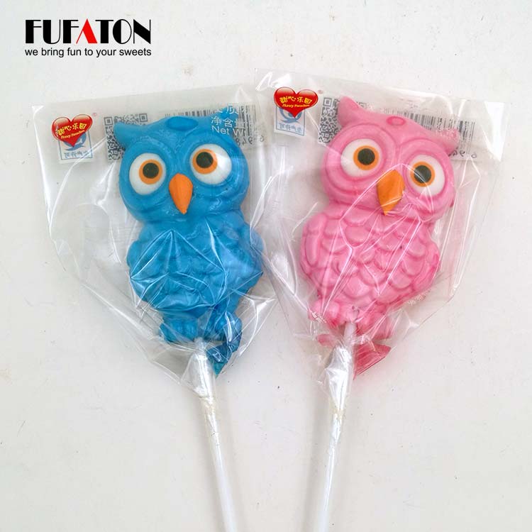 Owl shaped candy lollipop with hand decoration