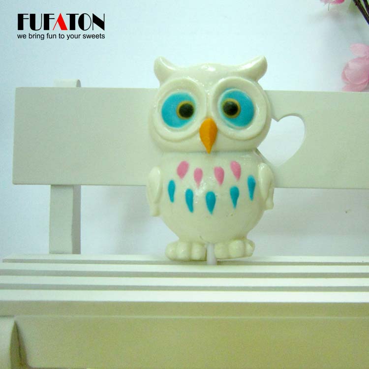 Owl shaped candy lollipop with hand decoration